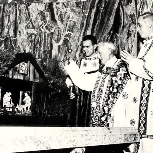 Three members of the clergy conduct the Blessing of the Crib ceremony