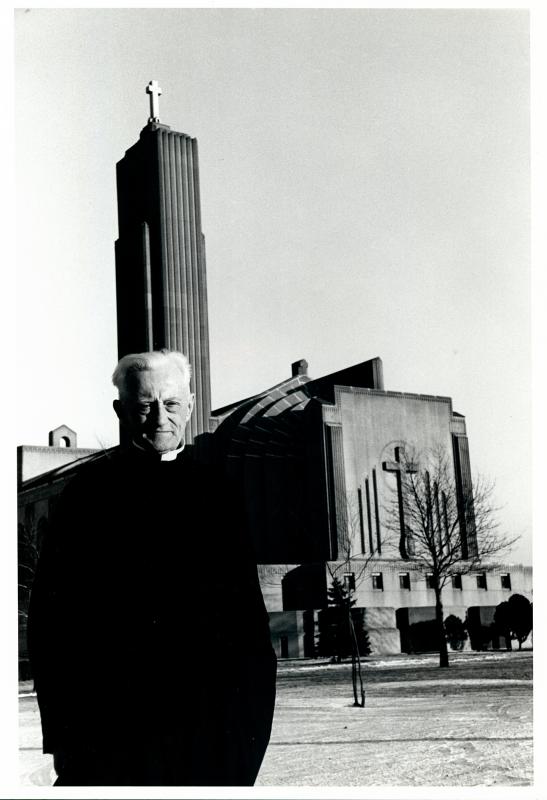 Father James Mertz, S.J. standing outside Madonna della Strada Chapel.
