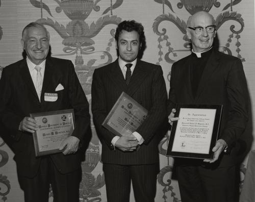 Morris Weinstein, MD., Rubin Metha, and Fr. Maguire, SJ receive awards at the Loyola University Chicago Centennial Citation Awards. 